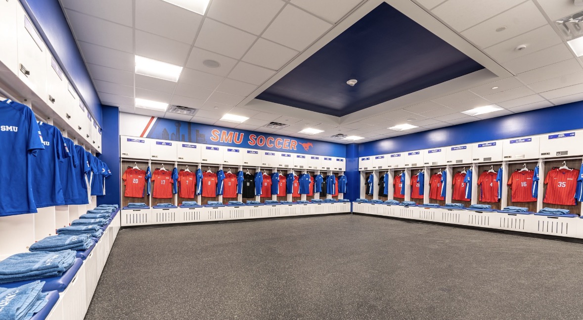 SMU soccer locker room with red and blue jerseys lined up in lockers