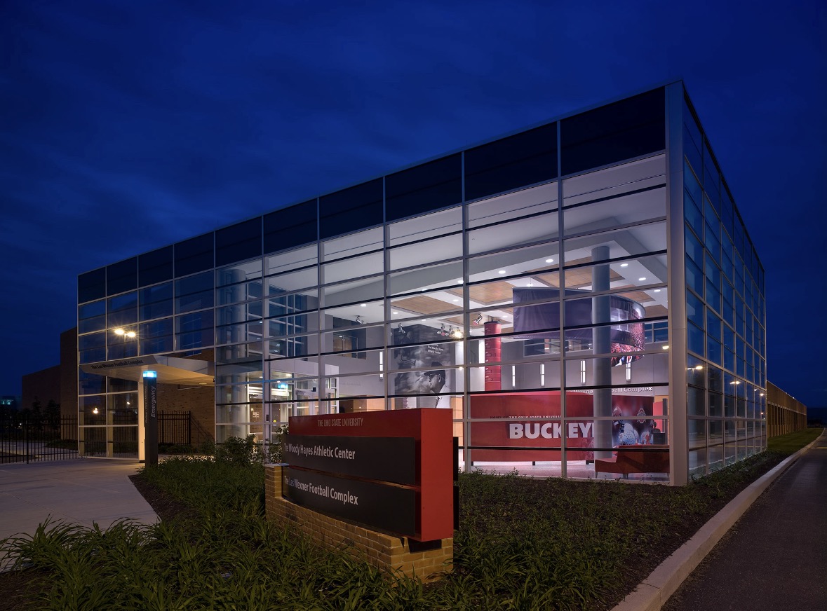 Woody Hayes Athletic Center at Ohio State University lit up at dusk