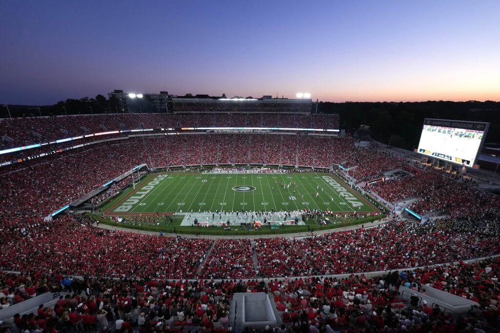 Sanford Stadium at dusk filled with Georgia fans in red
